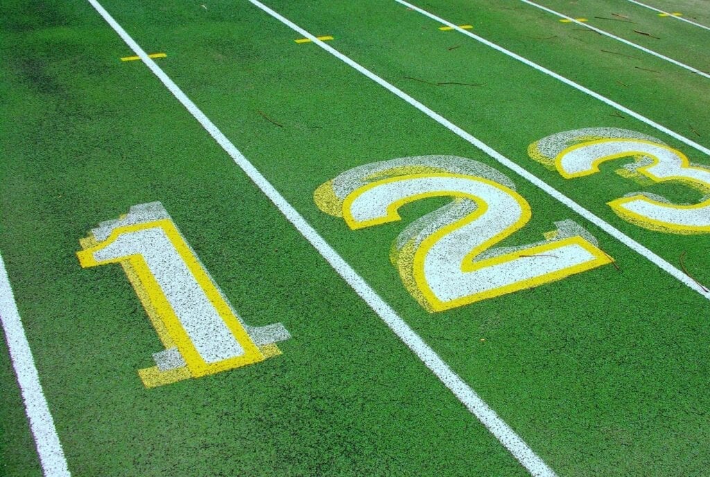 Close-up of the 10, 20, and 30-yard lines on a football field.