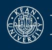 Logo of Kean University featuring a classical emblem and text.